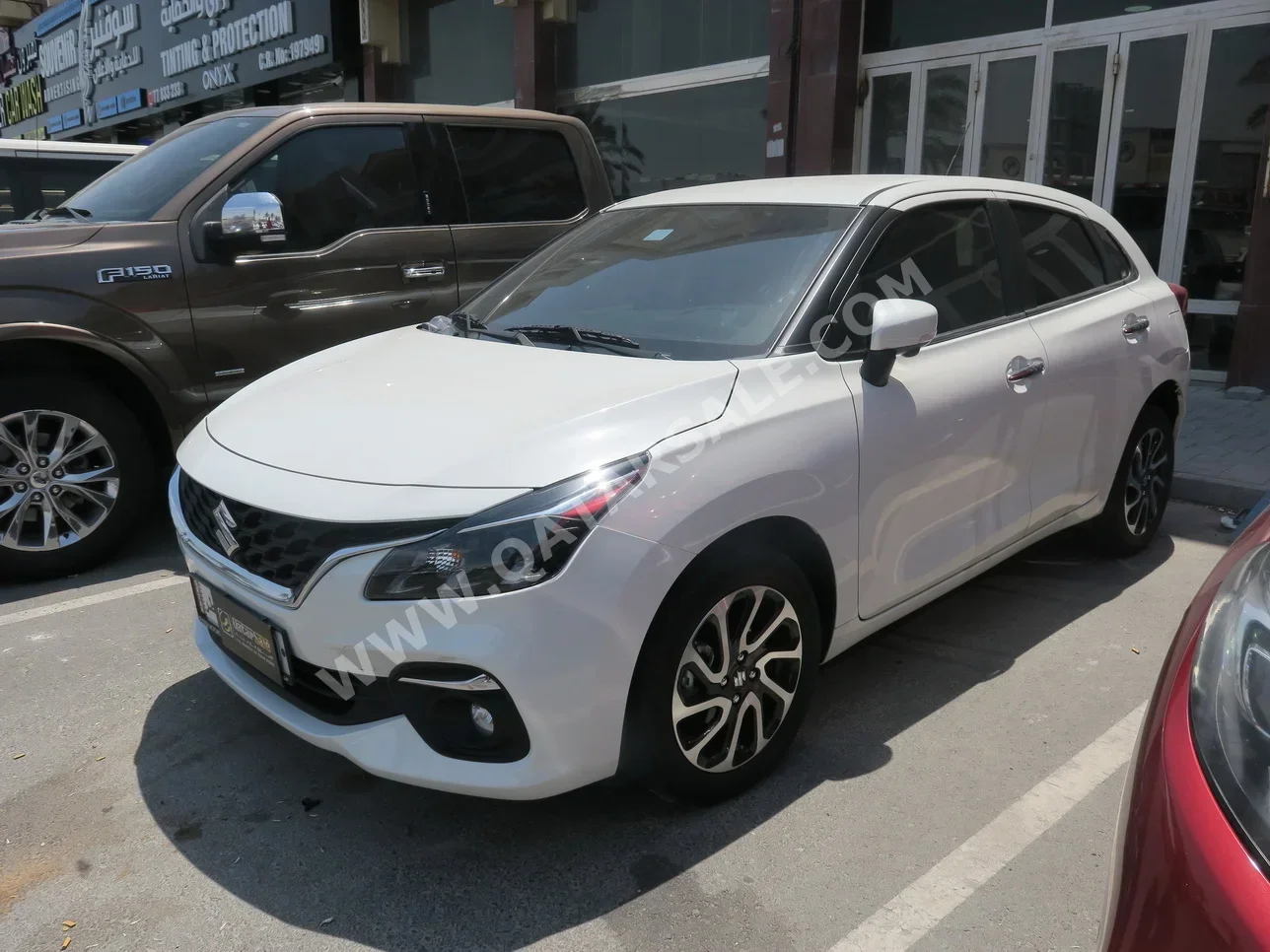 Suzuki  Baleno  2024  Automatic  23,000 Km  4 Cylinder  Front Wheel Drive (FWD)  Sedan  White  With Warranty