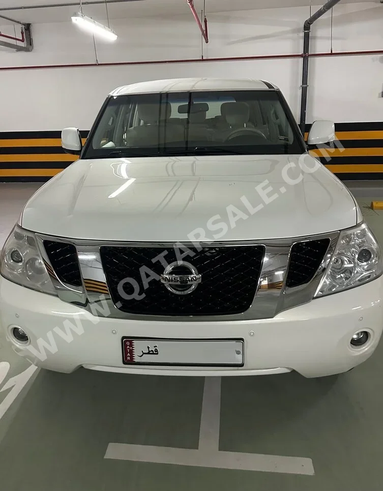 Nissan  Patrol  SE  2013  Automatic  144,400 Km  8 Cylinder  Four Wheel Drive (4WD)  SUV  White