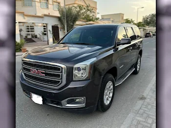 GMC  Yukon  SLE  2015  Automatic  207,000 Km  8 Cylinder  Four Wheel Drive (4WD)  SUV  Brown