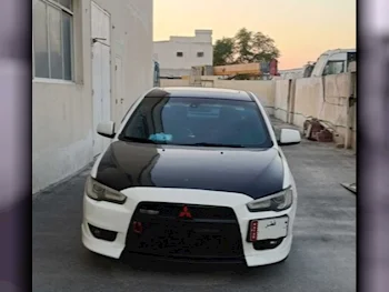 Mitsubishi  Lancer  GT  2014  Automatic  170,000 Km  4 Cylinder  Front Wheel Drive (FWD)  Sedan  White & Black