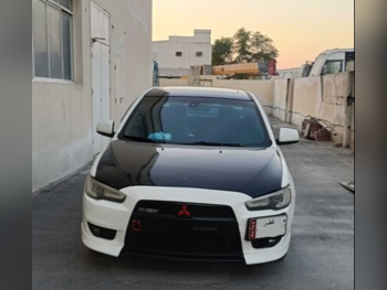 متسوبيشي  لانسر  جي تي  2014  اوتوماتيك  180,000 كم  4 سلندر  سحب امامي  سيدان  أبيض و أسود