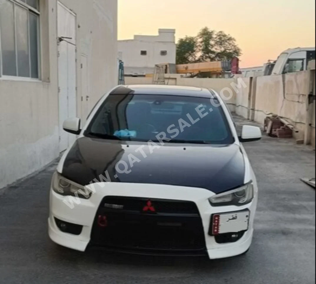 Mitsubishi  Lancer  GT  2014  Automatic  170,000 Km  4 Cylinder  Front Wheel Drive (FWD)  Sedan  White & Black