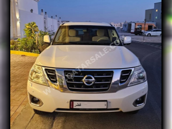 Nissan  Patrol  SE  2015  Automatic  97,000 Km  8 Cylinder  Four Wheel Drive (4WD)  SUV  White