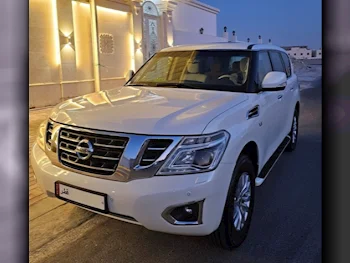 Nissan  Patrol  SE  2015  Automatic  97,000 Km  8 Cylinder  Four Wheel Drive (4WD)  SUV  White