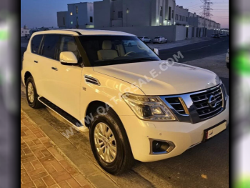 Nissan  Patrol  SE  2015  Automatic  97,000 Km  8 Cylinder  Four Wheel Drive (4WD)  SUV  White