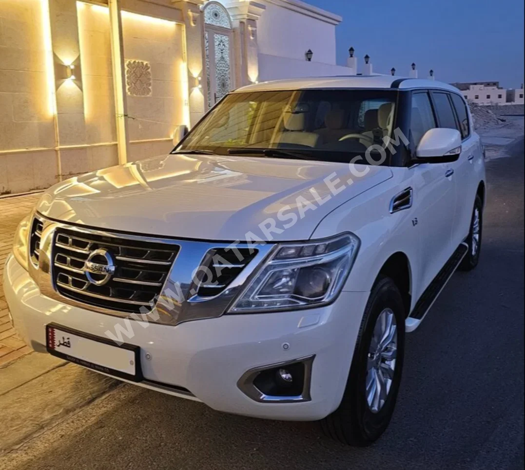 Nissan  Patrol  SE  2015  Automatic  97,000 Km  8 Cylinder  Four Wheel Drive (4WD)  SUV  White