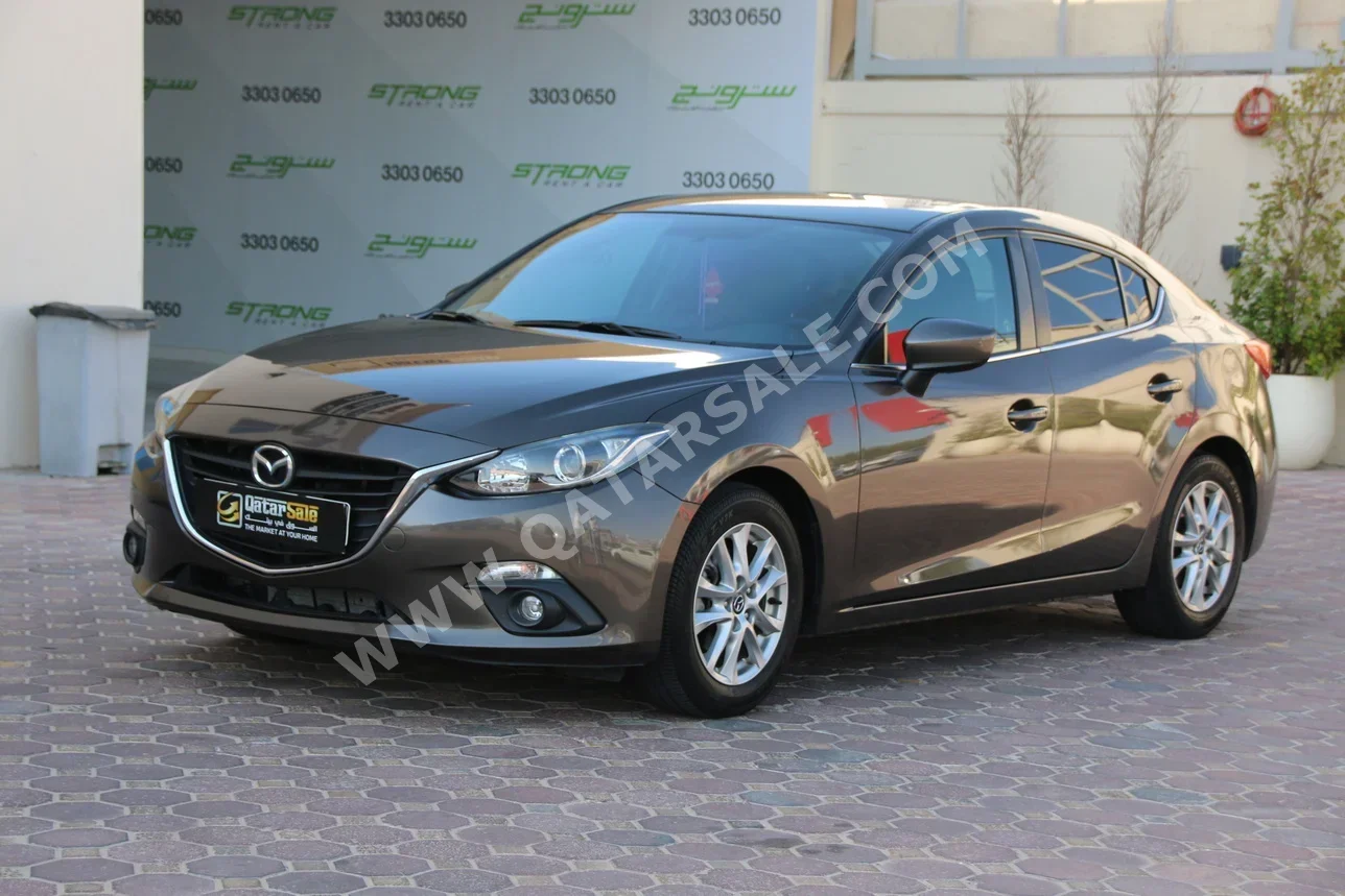Mazda  Mazda 3  2015  Automatic  147,000 Km  4 Cylinder  Front Wheel Drive (FWD)  Sedan  Gray
