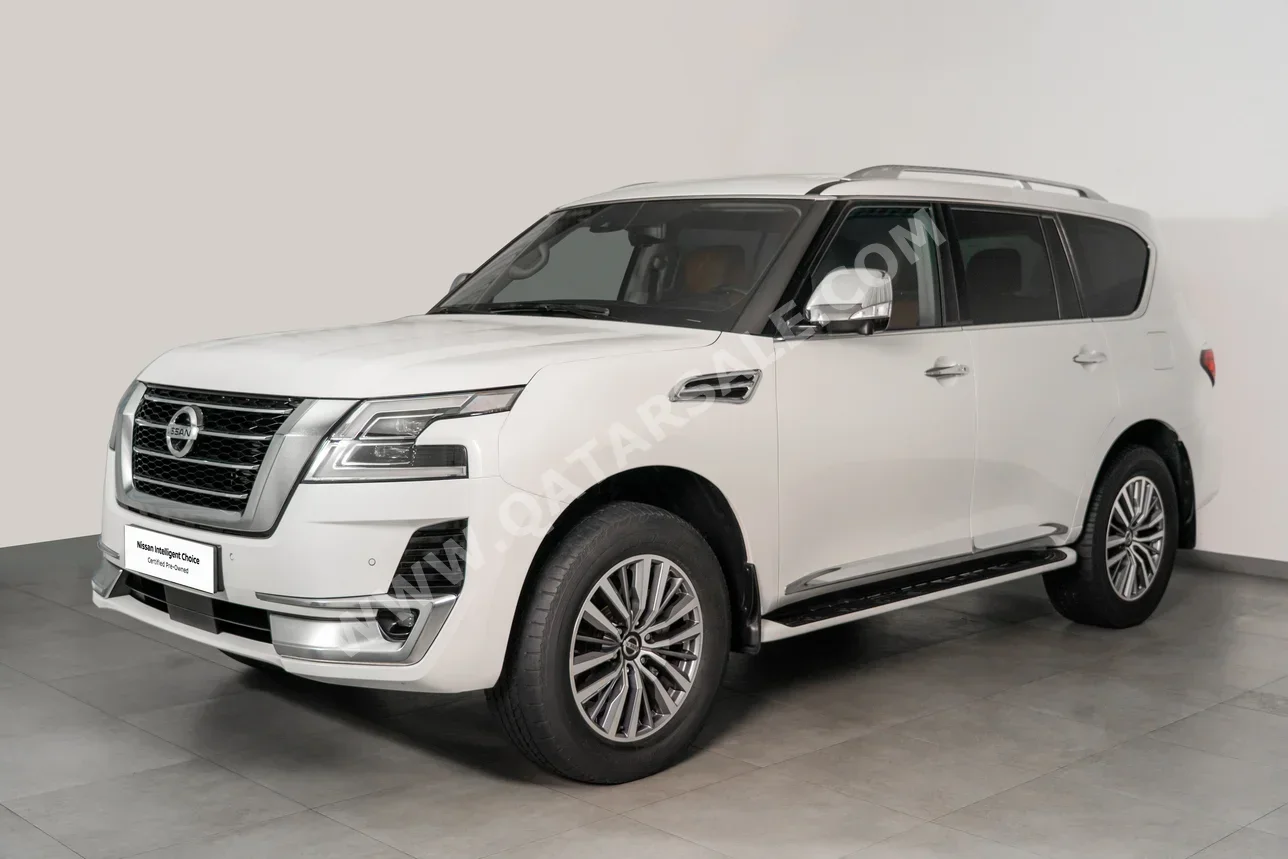 Nissan  Patrol  SE Platinum  2021  Automatic  59,911 Km  6 Cylinder  Four Wheel Drive (4WD)  SUV  White  With Warranty