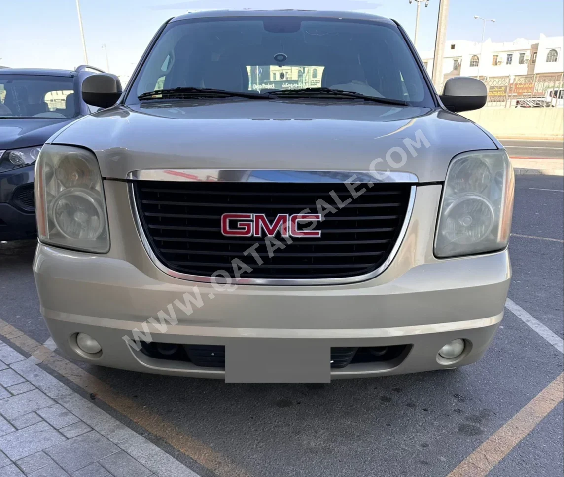 GMC  Yukon  SLE  2011  Automatic  268,000 Km  8 Cylinder  Rear Wheel Drive (RWD)  SUV  Gold
