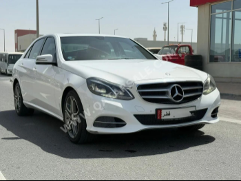 Mercedes-Benz  E-Class  200  2016  Automatic  75,000 Km  4 Cylinder  Rear Wheel Drive (RWD)  Sedan  White