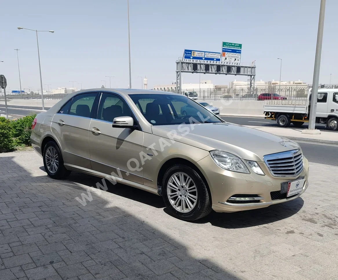 Mercedes-Benz  E-Class  200  2012  Automatic  310,000 Km  4 Cylinder  Rear Wheel Drive (RWD)  Sedan  Gold