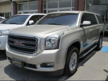 GMC  Yukon  XL  2015  Automatic  138,000 Km  8 Cylinder  Four Wheel Drive (4WD)  SUV  Gold