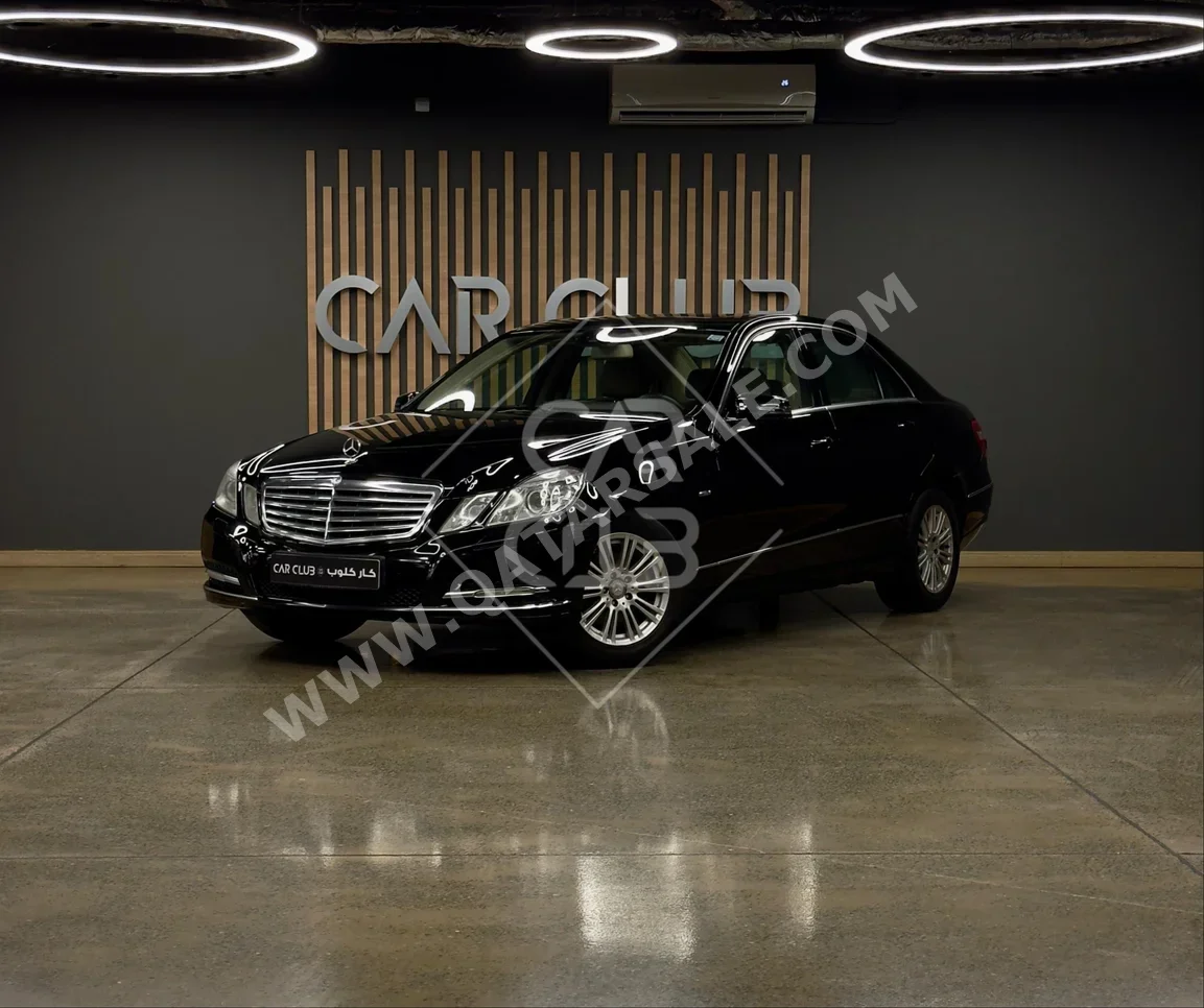 Mercedes-Benz  E-Class  200  2011  Automatic  70,000 Km  4 Cylinder  Rear Wheel Drive (RWD)  Sedan  Black
