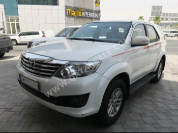 Toyota  Fortuner  2015  Automatic  110,000 Km  4 Cylinder  Four Wheel Drive (4WD)  SUV  White