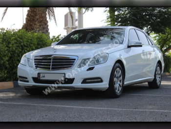 Mercedes-Benz  E-Class  200  2013  Automatic  125,000 Km  4 Cylinder  Rear Wheel Drive (RWD)  Sedan  White