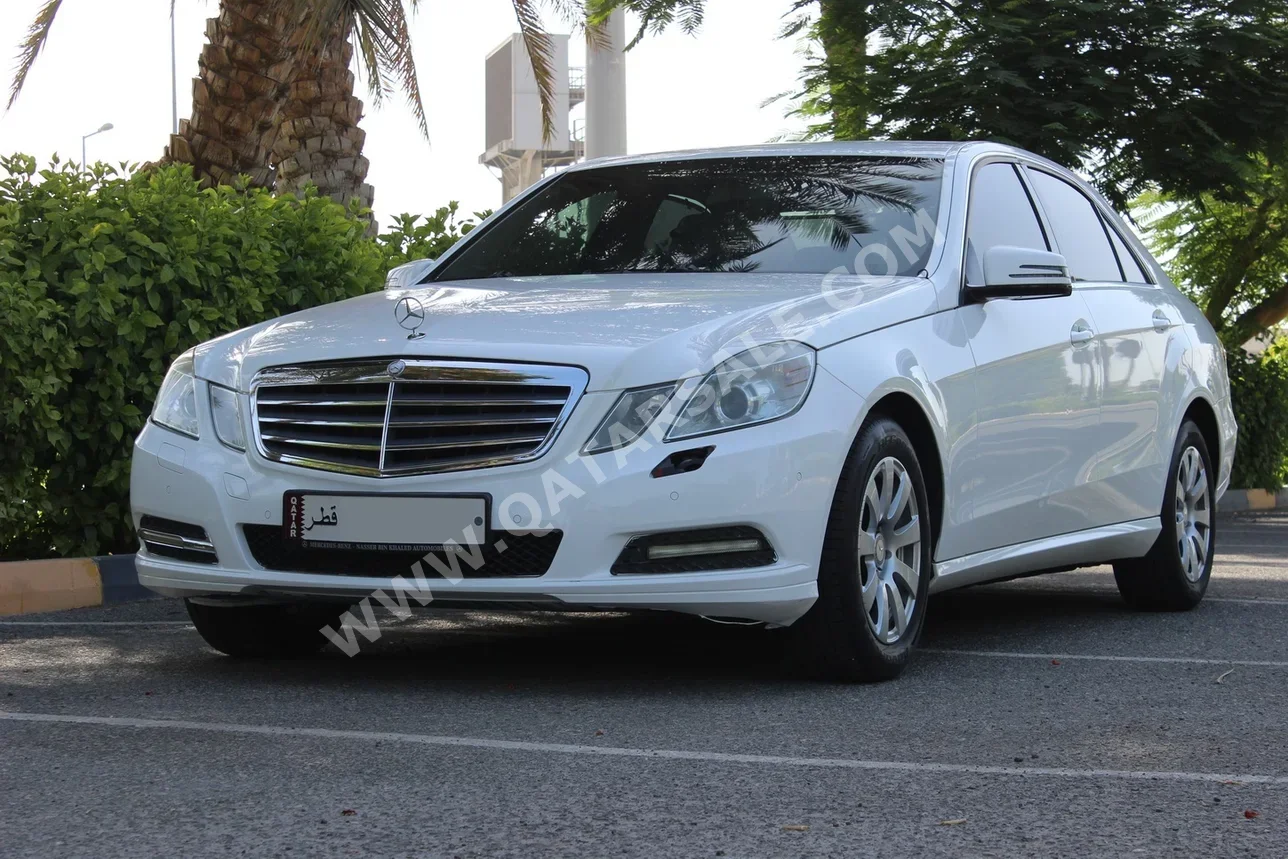 Mercedes-Benz  E-Class  200  2013  Automatic  125,000 Km  4 Cylinder  Rear Wheel Drive (RWD)  Sedan  White