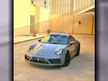 بورش  911  كاريرا جي تي اس  2024  اوتوماتيك  6,000 كم  6 سلندر  دفع خلفي  كوبيه \ سبورت  رمادي ناردو  تحت الضمان