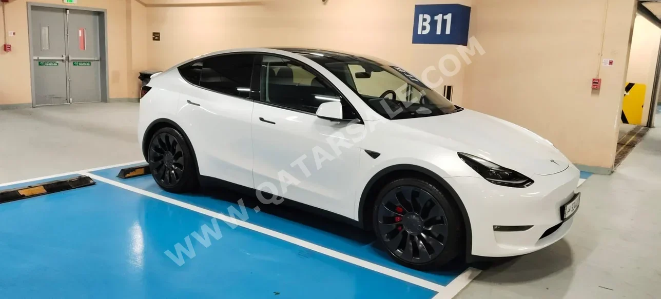 Tesla  Model Y  2024  Automatic  10,000 Km  0 Cylinder  All Wheel Drive (AWD)  Sedan  White  With Warranty