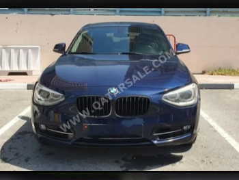 BMW  1-Series  118i  2015  Automatic  142,000 Km  4 Cylinder  Rear Wheel Drive (RWD)  Hatchback  Dark Blue  With Warranty