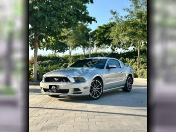 Ford  Mustang  GT Premium  2014  Manual  99,000 Km  8 Cylinder  Rear Wheel Drive (RWD)  Coupe / Sport  Silver