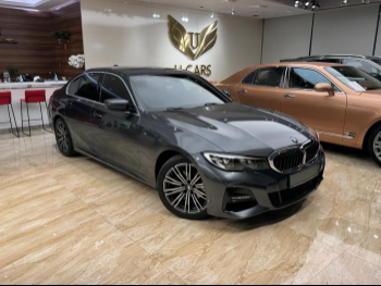 BMW  3-Series  320i  2021  Automatic  34,000 Km  4 Cylinder  Front Wheel Drive (FWD)  Sedan  Gray