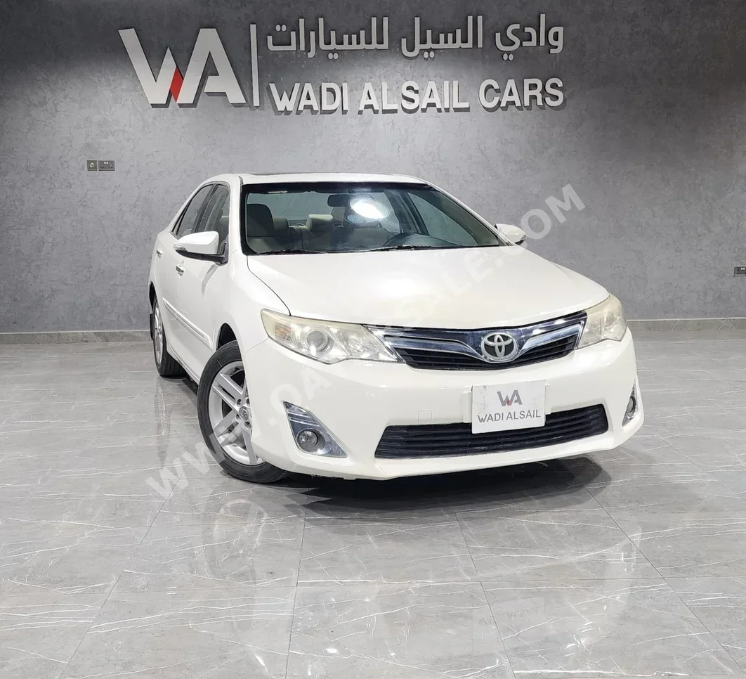 Toyota  Camry  GLX  2014  Automatic  79,000 Km  4 Cylinder  Front Wheel Drive (FWD)  Sedan  White