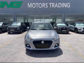 Suzuki  Dzire  2023  Automatic  105,000 Km  4 Cylinder  Front Wheel Drive (FWD)  Sedan  Gray  With Warranty