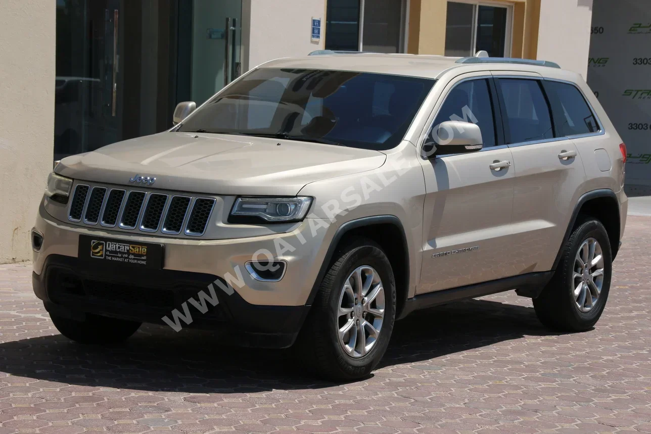 Jeep  Grand Cherokee  Laredo  2014  Automatic  140,000 Km  6 Cylinder  Four Wheel Drive (4WD)  SUV  Gold