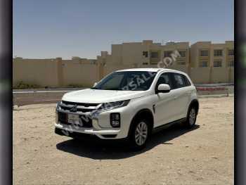Mitsubishi  ASX  2023  Automatic  30,000 Km  4 Cylinder  Front Wheel Drive (FWD)  SUV  White  With Warranty