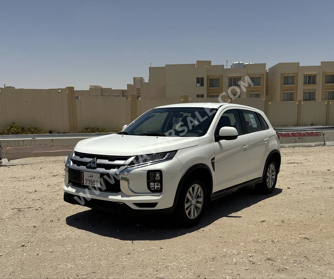 Mitsubishi  ASX  2023  Automatic  30,000 Km  4 Cylinder  Front Wheel Drive (FWD)  SUV  White  With Warranty