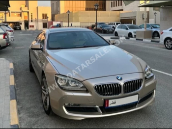 BMW  6-Series  640i Gran Coupe  2013  Automatic  148,000 Km  6 Cylinder  Rear Wheel Drive (RWD)  Sedan  Gold