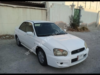 Subaru  Impreza  2004  Manual  184,000 Km  4 Cylinder  All Wheel Drive (AWD)  Sedan  White