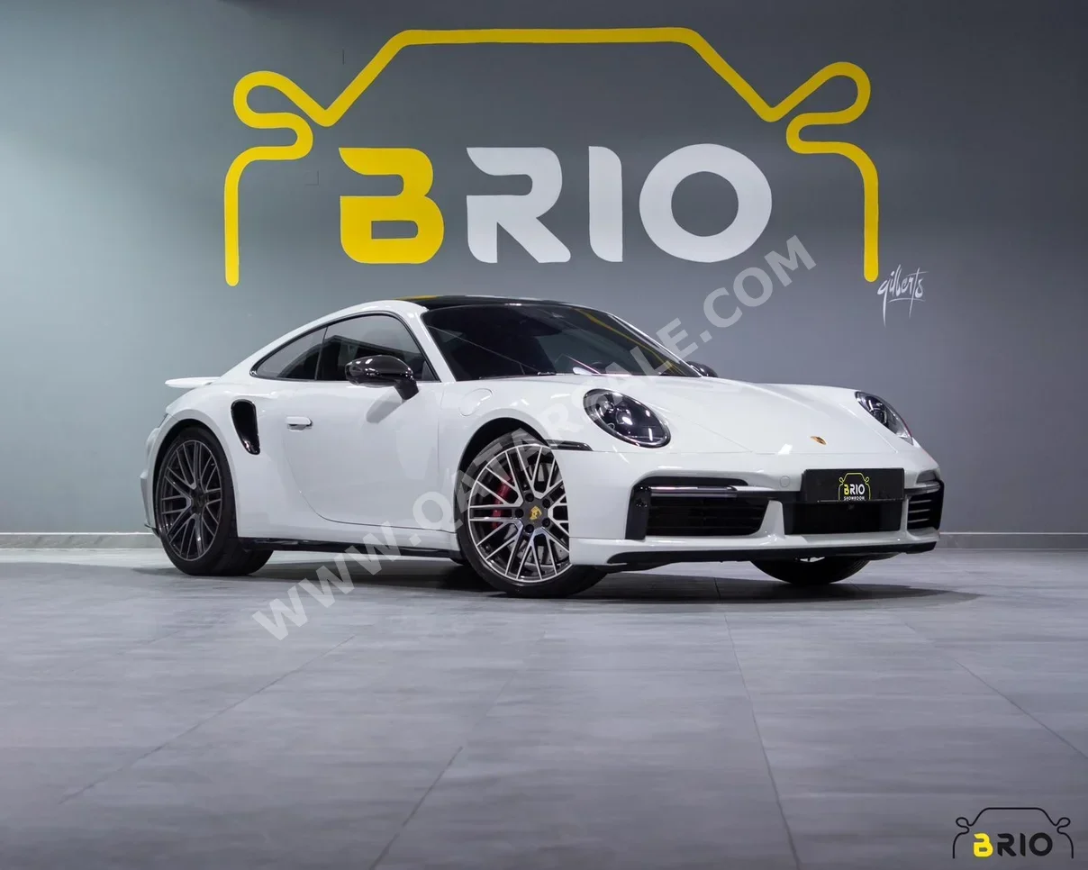 بورش  911  توربو  2022  اوتوماتيك  27,000 كم  8 سلندر  دفع خلفي  كوبيه \ سبورت  أبيض