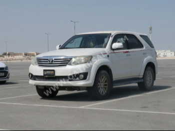  Toyota  Fortuner  2014  Automatic  243,000 Km  4 Cylinder  Four Wheel Drive (4WD)  SUV  White  With Warranty