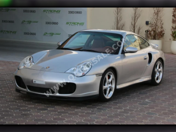 بورش  911  توربو  2003  اوتوماتيك  102,000 كم  6 سلندر  دفع خلفي  كوبيه \ سبورت  فضي