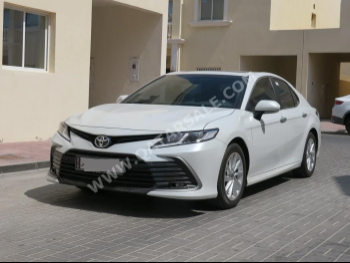 Toyota  Camry  2023  Automatic  12,000 Km  4 Cylinder  Front Wheel Drive (FWD)  Sedan  White  With Warranty