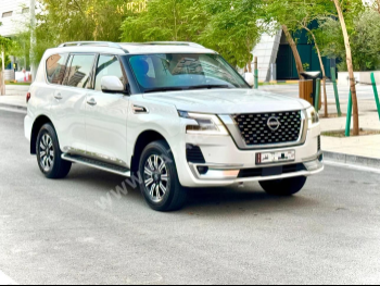 Nissan  Patrol  Titanium  2023  Automatic  62,000 Km  6 Cylinder  Four Wheel Drive (4WD)  SUV  White  With Warranty
