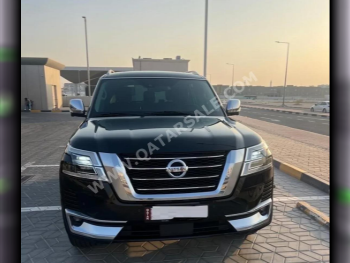 Nissan  Patrol  Platinum  2021  Automatic  89,200 Km  6 Cylinder  Four Wheel Drive (4WD)  SUV  Black  With Warranty