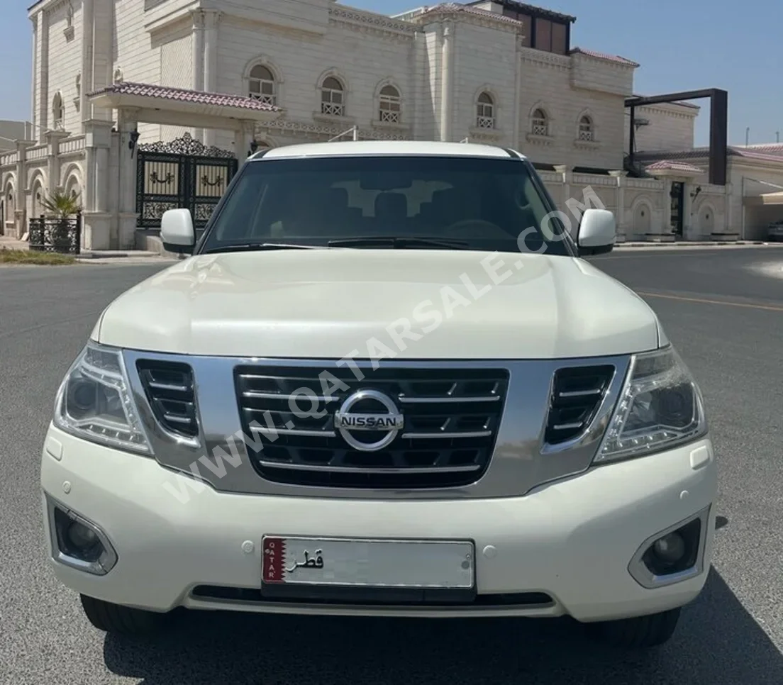 Nissan  Patrol  SE  2014  Automatic  183,000 Km  8 Cylinder  Four Wheel Drive (4WD)  SUV  White