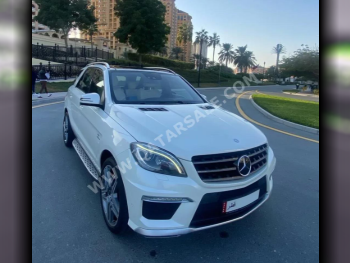 مرسيدس - بنز  ام ال  63 AMG  2013  اوتوماتيك  119,000 كم  8 سلندر  دفع كلي مستمر  اس يو في  أبيض