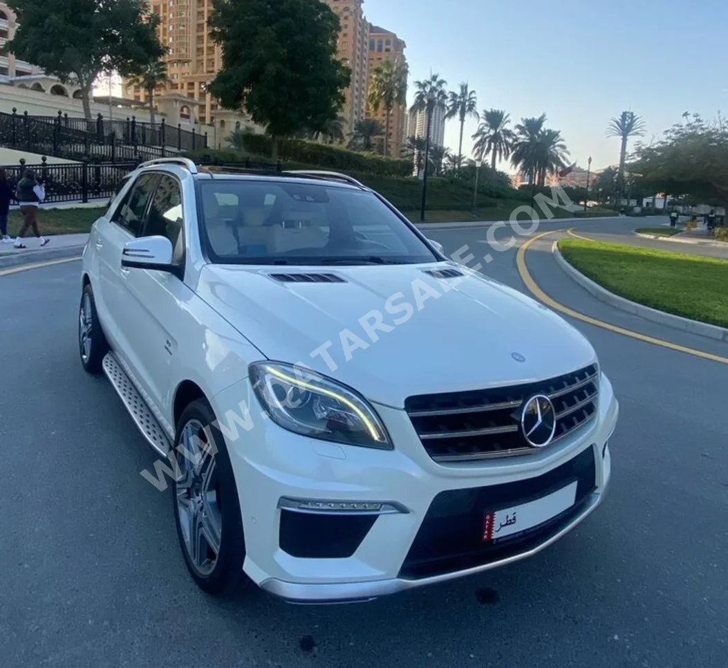 مرسيدس - بنز  ام ال  63 AMG  2013  اوتوماتيك  119,000 كم  8 سلندر  دفع كلي مستمر  اس يو في  أبيض