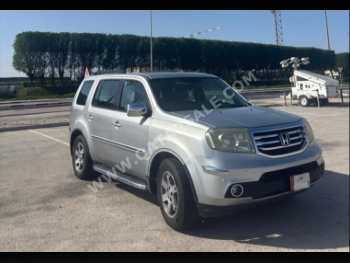 Honda  Pilot  EXL  2014  Automatic  172,000 Km  6 Cylinder  All Wheel Drive (AWD)  SUV  Silver