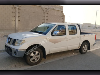 Nissan  Navara  2014  Manual  405,000 Km  4 Cylinder  Rear Wheel Drive (RWD)  Pick Up  White