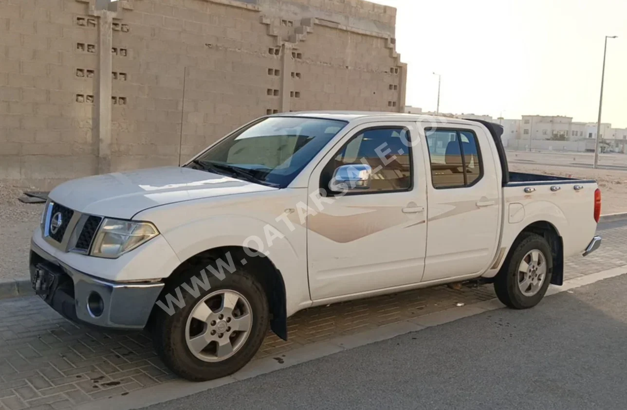 Nissan  Navara  2014  Manual  405,000 Km  4 Cylinder  Rear Wheel Drive (RWD)  Pick Up  White