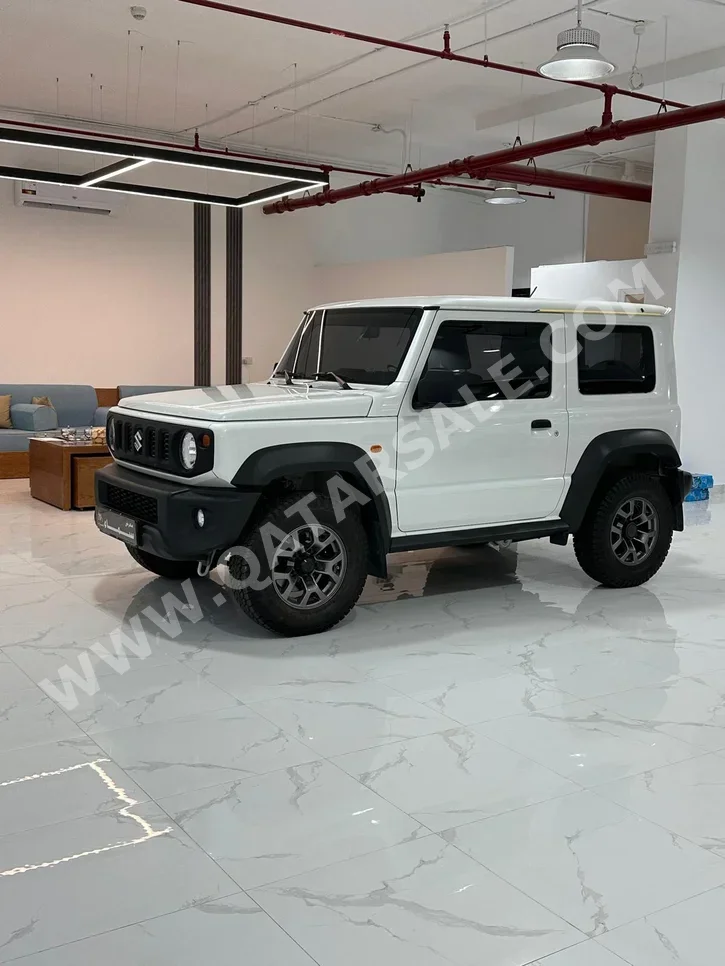 Suzuki  Jimny  2023  Manual  30,000 Km  4 Cylinder  Four Wheel Drive (4WD)  SUV  White  With Warranty