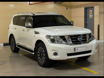 Nissan  Patrol  Platinum  2015  Automatic  218,000 Km  8 Cylinder  Four Wheel Drive (4WD)  SUV  White