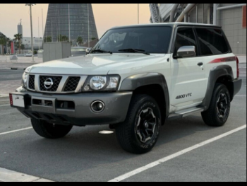 Nissan  Patrol  Super Safari  2021  Manual  104,000 Km  6 Cylinder  Four Wheel Drive (4WD)  SUV  White and Silver