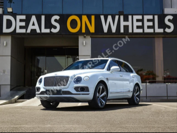 Bentley  Bentayga  2018  Automatic  79,000 Km  12 Cylinder  All Wheel Drive (AWD)  SUV  White