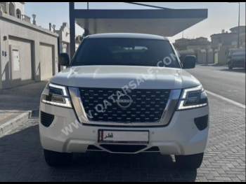 Nissan  Patrol  XE  2022  Automatic  33,000 Km  6 Cylinder  Four Wheel Drive (4WD)  SUV  White  With Warranty