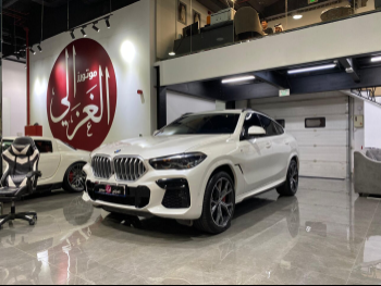 BMW  X-Series  X6  2022  Automatic  60,000 Km  6 Cylinder  Four Wheel Drive (4WD)  SUV  White  With Warranty